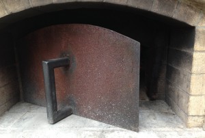 Use door to regulate smoke and fire, your wood-fired pizza oven makes a great smoker