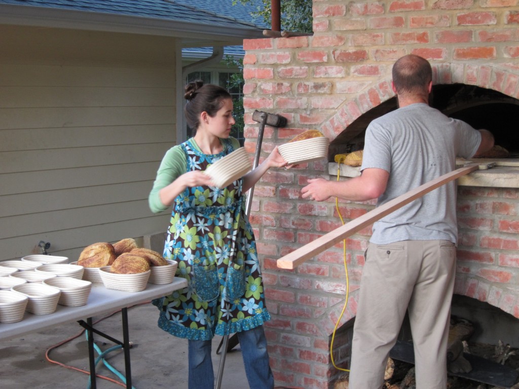 John & Nicole bake bread in a wood-fired oven pizza oven