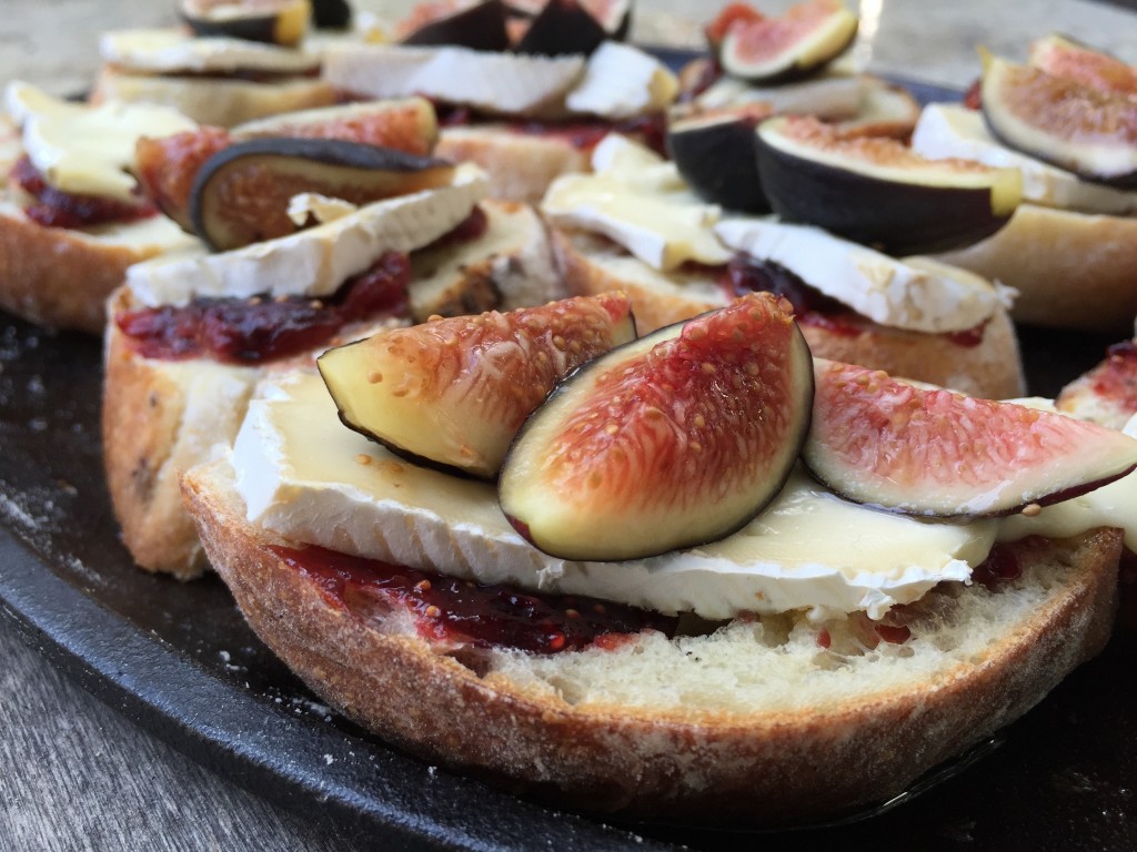 wood-fired oven, pizza-oven, fire-roasted figs on artisan bread with brie and arugula. 