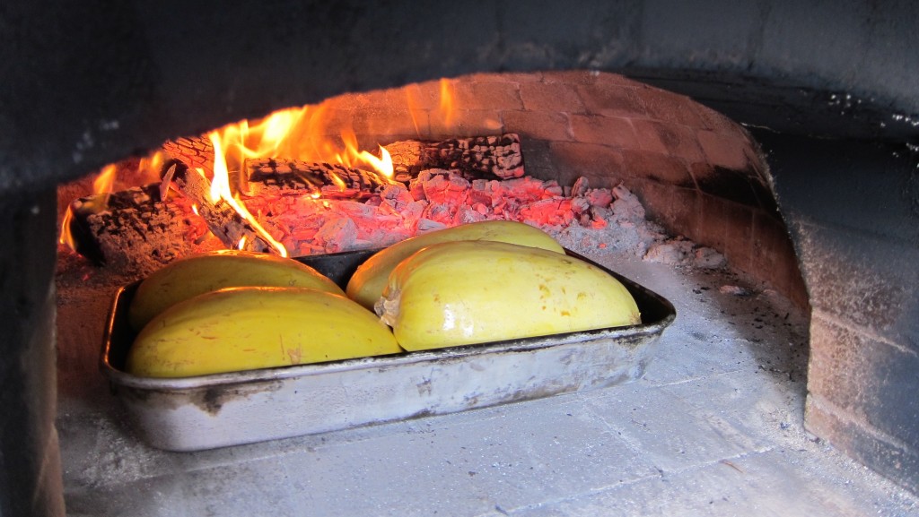 Spaghetti squash roasting in wood-fired oven Texas Oven Co. Austin, San Antonio, Houston