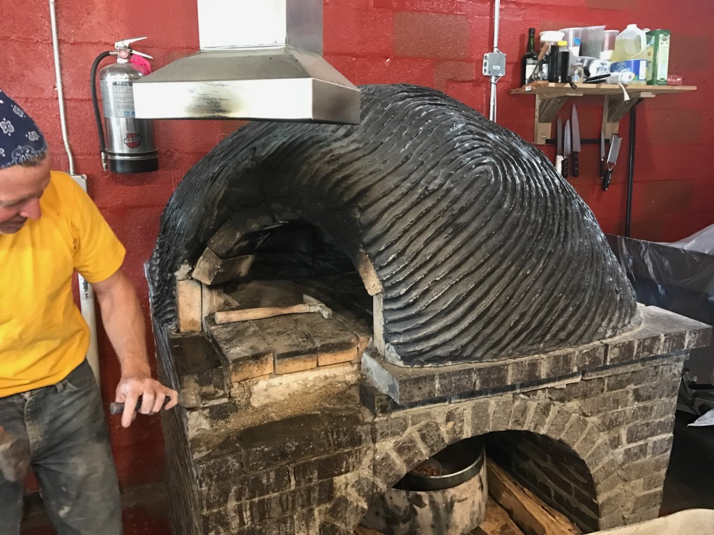 dave checks out the oven at il forno