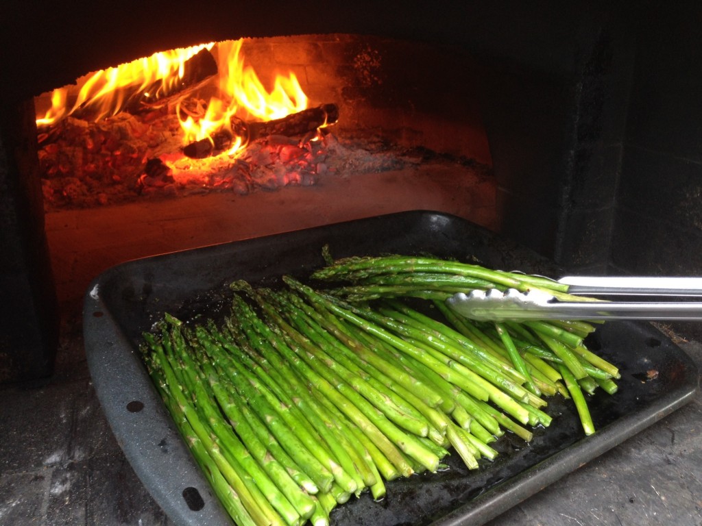 wood-fired asparagus roasted in wood-burning oven pizza oven perfectly done