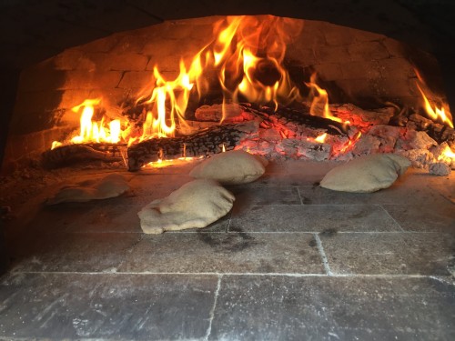 best homemade gyro pita puffing in wood-burining oven