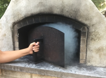 low and slow wood fired oven pizza oven door