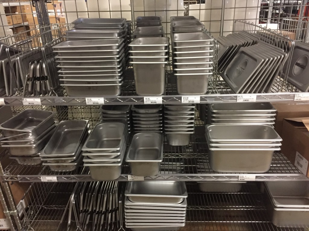 Lodge two different size fish pans one with cover. The cover is