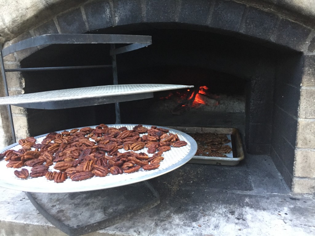 cooling roasted pecans on mesh cooling rounds