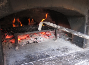 wood-fired grilling in a pizza oven wood-fired grilling in a wood-burning oven